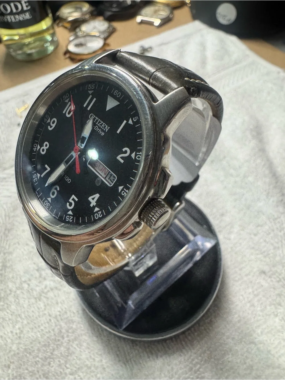 Citizen Men's Black Dial Watch with Red Second Hand and Brown Strap